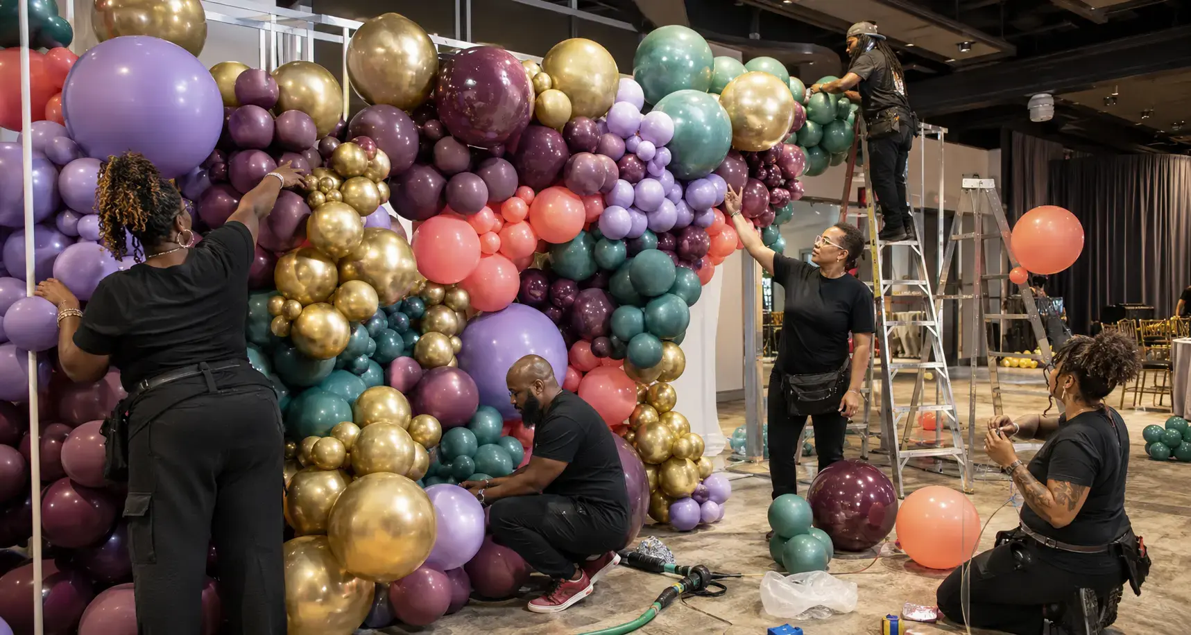 A multigenerational Atlanta balloon team building a large sculptural installation together.